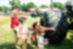 Close-up view of a monster truck crushing cars during a freestyle event
